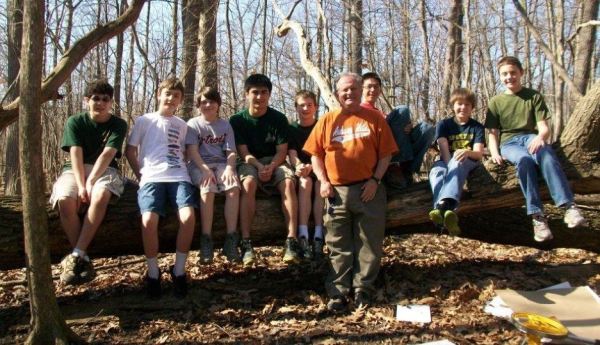Mike Mansour, pictured here with scouts, leads groups through the process of earning merit badges